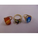 14ct yellow gold ring, 10ct yellow gold ring and a 9ct yellow gold ring, all set with semi