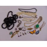 A quantity of costume jewellery to include necklaces, brooches, bracelets and earrings