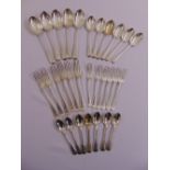 A quantity of silver flatware to include spoons and forks, crests engraved to terminals, various