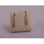 A pair of 9ct white gold and diamond drop earrings, approx total weight 2.4g