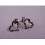 A pair of 9ct white gold and diamond heart shaped earrings, approx total weight 2.1g