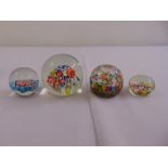 Four Millefiori glass paperweights of customary form