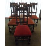 Six oak dining chairs with turned supports and upholstered seats
