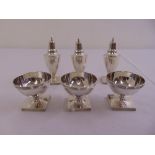 A George III Scottish silver six piece condiment set to include three vase form peppers and three