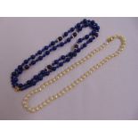 A set of cultured pearls with 18ct clasp and a string of lapis beads set with gold clasp and
