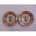 A pair of Satsuma plates decorated with flowers, leaves and scrolls