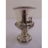 A William IV silver cup, campagna form chased with flowers and leaves on raised circular base,
