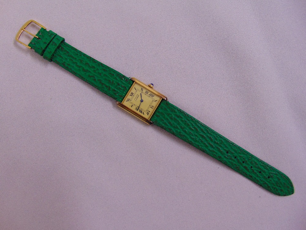 Must de Cartier gold plated tank quartz wristwatch on green leather strap