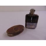 An oval silver plated snuff box inset with an 1806 coin and a silver plated hip flask