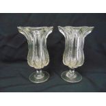 A pair of Victorian celery vases of baluster form with ribbed sides on circular spreading bases, one