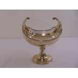 A silver table centre piece the oval bowl with ovolo pierced border on raised oval base, London