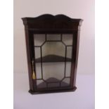 Mahogany glazed wall mounted display cabinet with hinged door