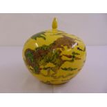Chinese globular yellow ground ginger jar and cover decorated with dragons and stylised clouds