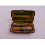 A pair of silver mounted cheroot holders in fitted leather case