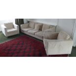 A three piece upholstered lounge suite to include a three seater couch and two armchairs