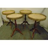Four Epstein circular side tables with pink marble tops and gilt metal galleries on three scroll