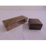 A rectangular silver cigarette box with hinged cover and a hand hammered silver cigarette box