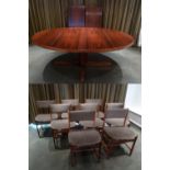 Doumas Danish rosewood oval pedestal dining table with two drop in leaves and eight dining chairs