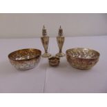 A silver salt and pepper, a white metal Chinese salt and two white metal Monte Carlo bowls