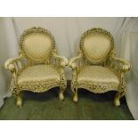 A pair of decorative armchairs inlaid with bone, upholstered seats and backs with scrolling arms