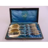 A cased set of six continental white metal tablespoons