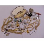 A quantity of costume jewellery to include necklaces, brooches, pendants and watches