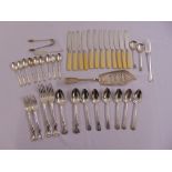 A quantity of silver flatware to include a fish slice, a pair of sugar tongs, spoons, forks and