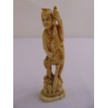 Meiji period Japanese carved ivory figurine of a fisherman holding fish
