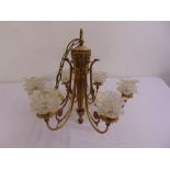 Gilt metal and glass six branch chandelier the pierced scrolling arms supporting frosted glass