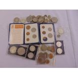 A quantity of GB and foreign coins to include silver, cupro nickel and decimal sets