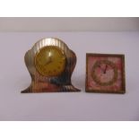 A silver mounted eight day clock and a brass and enamel mounted clock