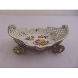 Meissen table centre piece shaped oval with pierced sides on four wheels, decorated with flowers and