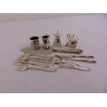 A quantity of silver and white metal to include a four piece condiment set and flatware