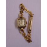 Ebel 9ct yellow gold ladies wristwatch on a gold plated bracelet