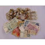 A quantity of banknotes and coins including Nigeria, Germany, Brazil, Luxembourg, Hungary, Latvia,