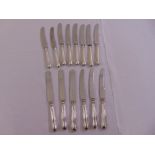 A quantity of silver handled table knives and dessert knives (14)
