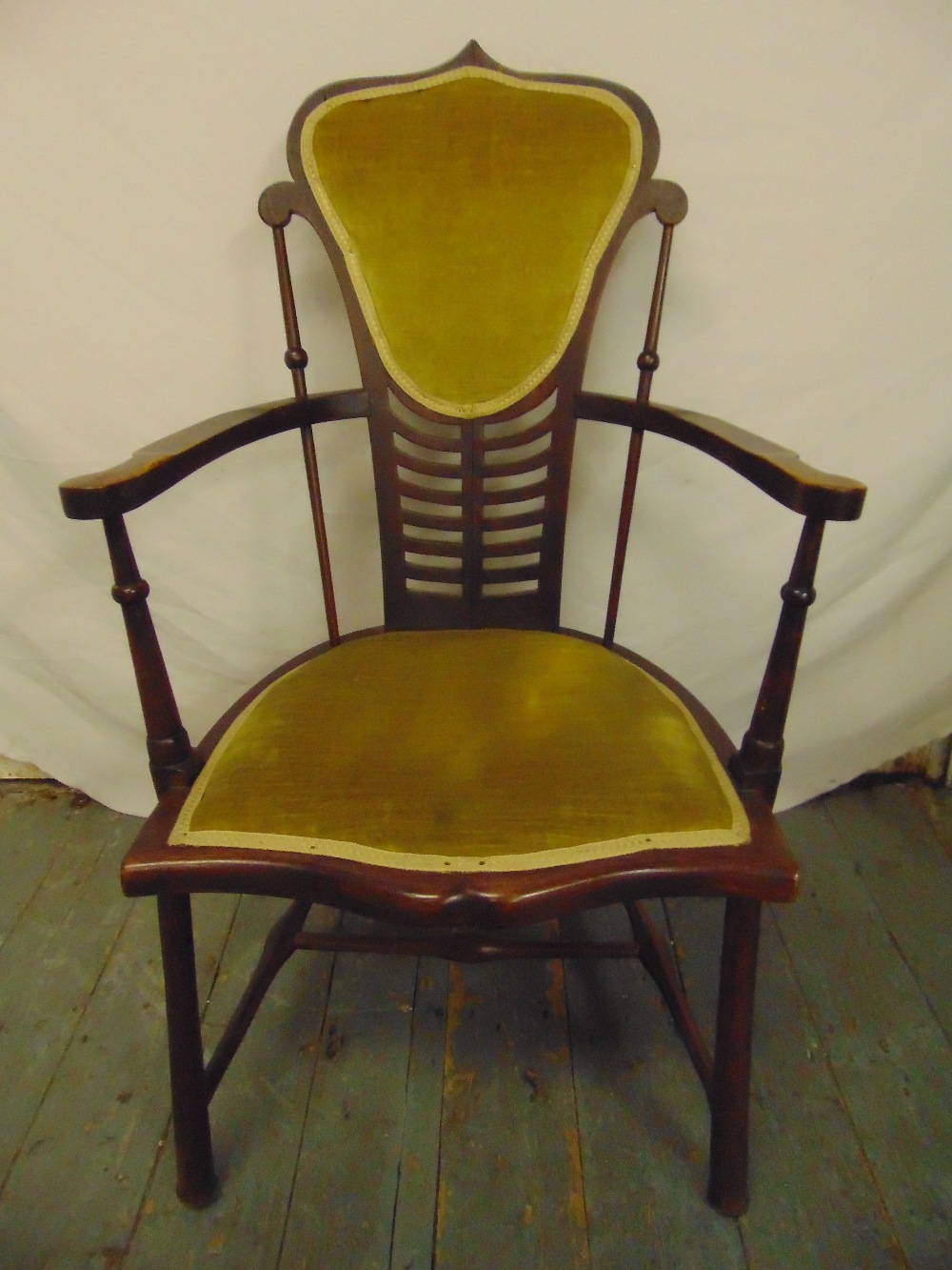 An Edwardian bedroom chair with upholstered seat and back