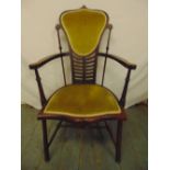 An Edwardian bedroom chair with upholstered seat and back