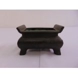 Chinese rectangular Ming style bronze incense burner on four bracket feet