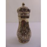 A Victorian silver sugar sifter pear shaped, chased with flowers and leaves and pull off cover,