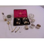 A quantity of silver to include teaspoons, napkin rings, a bonbon dish, matchbox cover, dressing
