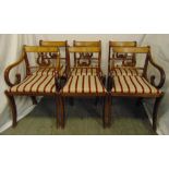 A set of six Edwardian mahogany harp back inlaid dining chairs, to include two carvers