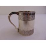 A Victorian silver mug, tapering cylindrical with reeded bands and scroll handle, London 1850