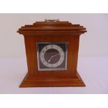 A mahogany mantle clock single train movement, silvered dial with Arabic numerals, to include key