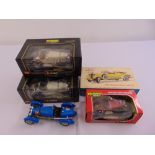 Three Burago 1/18 scale model cars in original packaging, one unboxed and a Hubley Classic car kit