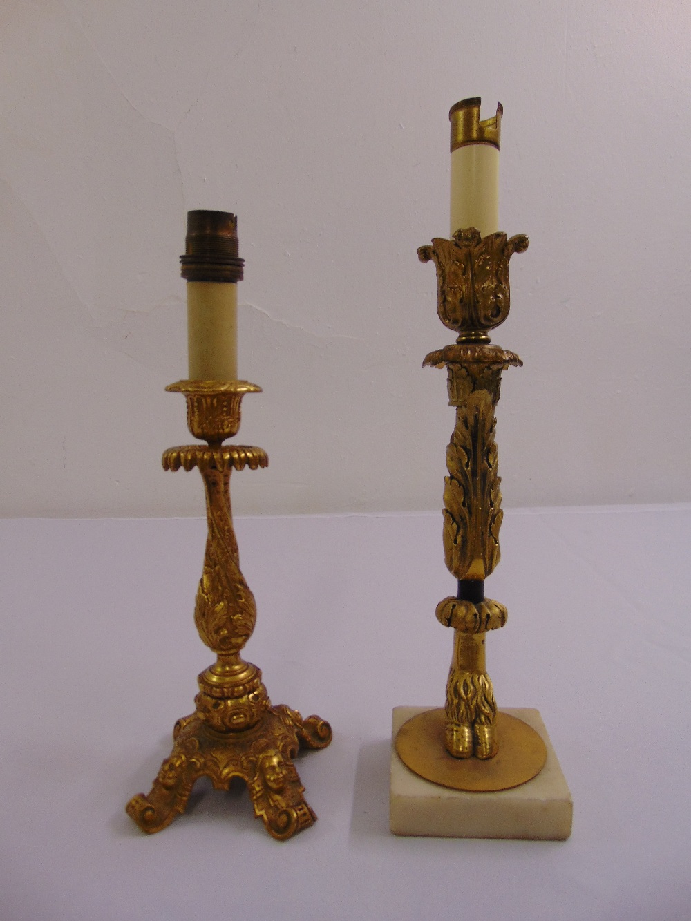 Two gilt metal table lamps, one mounted on marble base