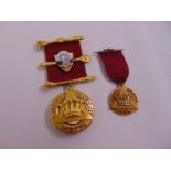 A 15ct yellow gold and enamel Masonic jewel and a 9ct yellow gold and enamel Masonic jewel