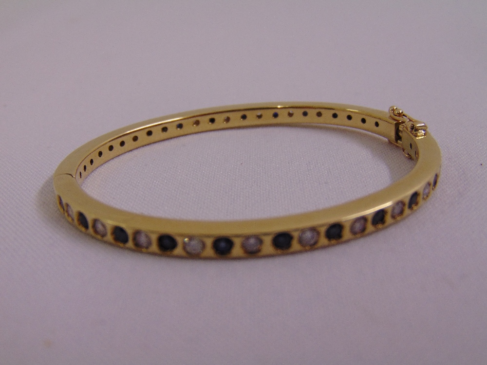 9ct yellow gold diamond and sapphire bangle, approx total weight 22.7g