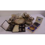A quantity of silver plate to include trays, teasets, dishes, coasters and a wine bottle holder