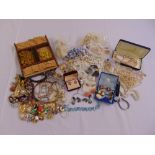 A quantity of costume jewellery to include necklaces, earrings and brooches